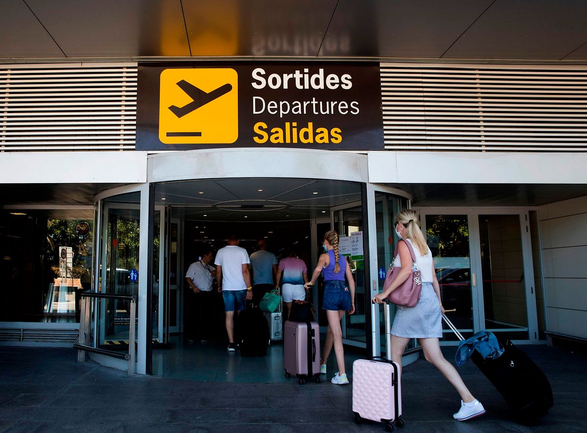 Tourists at Ibiza airport on 17 August Photo: AFP