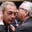 UK Independence Party (UKIP) leader Nigel Farage (L) talks with EU Commission President Jean-Claude Juncker before a plenary session at the EU headquarters in Brussels on June 28, 2016. 
European Commission chief Jean-Claude Juncker called on June 28 on Prime Minister David Cameron to clarify quickly when Britain intends to leave the EU, saying there can be no negotiation on future ties before London formally applies to exit. / AFP PHOTO / JOHN THYS